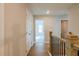 Upstairs hallway featuring wood floors and entry to bedrooms at 1730 Fulmont Cir, Mableton, GA 30126