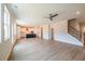 Open-concept living room featuring hardwood floors, recessed lighting, and a staircase at 1730 Fulmont Cir, Mableton, GA 30126