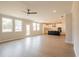 Open living room and kitchen space filled with natural light and featuring wood floors at 1730 Fulmont Cir, Mableton, GA 30126