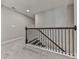 Staircase with carpeted steps, a gray wall, and a dark metal railing at 1020 Broadview Dr, Marietta, GA 30062