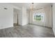 Bedroom boasts stylish floors, a chandelier, and natural light with a nearby window at 3636 Peachtree Ne Rd # 405, Atlanta, GA 30319