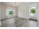 Bedroom features hardwood floors, a large window, and a door leading to an outdoor area at 3636 Peachtree Ne Rd # 405, Atlanta, GA 30319