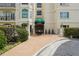 Elegant building entrance with manicured landscaping and a covered awning with address at 3636 Peachtree Ne Rd # 405, Atlanta, GA 30319