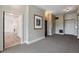 Inviting hallway featuring patterned carpeting, neutral walls, and access to various rooms and an elevator at 3636 Peachtree Ne Rd # 405, Atlanta, GA 30319
