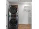 Compact laundry area featuring a stacked washer and dryer unit, perfect for saving space at 3636 Peachtree Ne Rd # 405, Atlanta, GA 30319