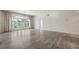 Large living room with hardwood floors, a chandelier, and French doors at 3636 Peachtree Ne Rd # 405, Atlanta, GA 30319