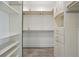 Spacious walk-in closet with built-in shelves and cabinets, offering ample storage and organization at 3636 Peachtree Ne Rd # 405, Atlanta, GA 30319
