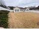 Large fenced backyard featuring a well-manicured lawn and mature trees at 5148 Centennial Creek Nw Vw, Acworth, GA 30102