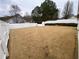 Large fenced backyard featuring a storage shed and mature trees at 5148 Centennial Creek Nw Vw, Acworth, GA 30102