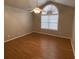 Bedroom with cathedral ceiling, fan, and unique arch window at 5148 Centennial Creek Nw Vw, Acworth, GA 30102