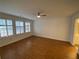 Hardwood bedroom with ceiling fan, natural light, and ensuite access at 5148 Centennial Creek Nw Vw, Acworth, GA 30102