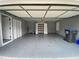 Spacious garage with shelving, offering storage and parking at 5148 Centennial Creek Nw Vw, Acworth, GA 30102