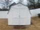 Exterior view of the shed, showcasing its double doors and classic design at 5148 Centennial Creek Nw Vw, Acworth, GA 30102