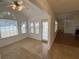 Bright sunroom with vaulted ceiling, ceiling fan, and multiple windows for natural light at 5148 Centennial Creek Nw Vw, Acworth, GA 30102