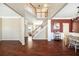 Spacious foyer featuring hardwood floors, staircase, and views of the living and dining areas at 6158 Brookmere Pl, Mableton, GA 30126