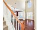 Open foyer featuring hardwood floors, high ceilings and a staircase to the second floor at 6158 Brookmere Pl, Mableton, GA 30126