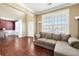 Comfortable living room with hardwood floors, neutral tones, and lots of natural light at 6158 Brookmere Pl, Mableton, GA 30126