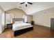 Spacious main bedroom features vaulted ceilings, wood floors, and ensuite bath at 6158 Brookmere Pl, Mableton, GA 30126