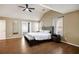 Spacious main bedroom with a ceiling fan, hardwood floors, and en suite bath at 6158 Brookmere Pl, Mableton, GA 30126