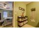 Bathroom with open shelving, a mirror, and a partial view into the bedroom at 6661 Gina Agha Cir, Lithonia, GA 30038