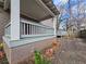 A covered back deck and walkway made with wood, next to the main house at 673 Pearce Sw St, Atlanta, GA 30310