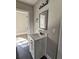 This bathroom features a modern vanity with custom mirror and contemporary lighting fixture at 673 Pearce Sw St, Atlanta, GA 30310