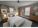 Stylish bedroom showcasing a patterned accent wall, complemented by modern furnishings and natural lighting at 673 Pearce Sw St, Atlanta, GA 30310