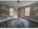 Stylish bedroom showcasing a patterned accent wall, complemented by modern furnishings and natural lighting at 673 Pearce Sw St, Atlanta, GA 30310