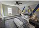 Stylishly furnished bedroom with blue and gold accents, hardwood floors at 673 Pearce Sw St, Atlanta, GA 30310