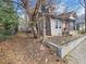 Charming craftsman style home with red door and a cozy front porch. Side yard at 673 Pearce Sw St, Atlanta, GA 30310