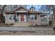 Charming craftsman-style home with a welcoming red door and inviting front porch at 673 Pearce Sw St, Atlanta, GA 30310