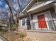 Close up of red front door, and landscaped yard of a craftsman style house at 673 Pearce Sw St, Atlanta, GA 30310