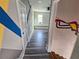 Hallway leading to a bedroom with hardwood floors and colorful wall design at 673 Pearce Sw St, Atlanta, GA 30310