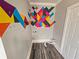 Laundry area with gray-washed wood flooring and colorful geometric design at 673 Pearce Sw St, Atlanta, GA 30310