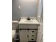 Charming bathroom featuring a stylish vanity with modern hardware and a sliding barn door at 687 N Hairston Rd, Stone Mountain, GA 30083