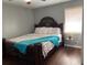 Bedroom featuring a large bed, hardwood floors, and ample natural light at 687 N Hairston Rd, Stone Mountain, GA 30083