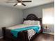 Bedroom featuring a large bed, hardwood floors, and ample natural light at 687 N Hairston Rd, Stone Mountain, GA 30083