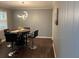 A view of the dining area showing modern lighting, wood flooring and gray paneled walls at 687 N Hairston Rd, Stone Mountain, GA 30083