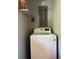 A view of a laundry room space showing a top load washer at 687 N Hairston Rd, Stone Mountain, GA 30083