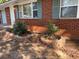 View of the front of the home showing updated landscaping in the front yard at 687 N Hairston Rd, Stone Mountain, GA 30083