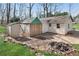 View of home's backyard, featuring fire pit and storage shed at 881 Brighton Dr, Lawrenceville, GA 30043