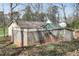 Backyard view with privacy fence, storage shed and green yard at 881 Brighton Dr, Lawrenceville, GA 30043