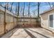 View of the backyard featuring a patio, wooden fence, and the side of the house at 881 Brighton Dr, Lawrenceville, GA 30043