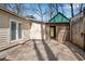 Backyard patio area connected to the house, with a fence and greenery visible at 881 Brighton Dr, Lawrenceville, GA 30043