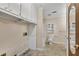 Bathroom featuring a toilet, bathtub, cabinets, and a doorway leading to another area at 881 Brighton Dr, Lawrenceville, GA 30043