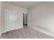 Cozy bedroom with plush carpeting and a view into the hallway at 1286 Brookins Trl, Atlanta, GA 30316