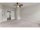 Empty bedroom featuring neutral paint, carpeted floor, and ceiling fan at 1286 Brookins Trl, Atlanta, GA 30316