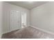 Bedroom with carpet, featuring an ensuite bathroom and a closet at 1286 Brookins Trl, Atlanta, GA 30316