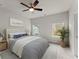 Bedroom with neutral decor, large windows, and ceiling fan at 1286 Brookins Trl, Atlanta, GA 30316