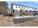 View of townhome exteriors with garages, decks and modern design at 1286 Brookins Trl, Atlanta, GA 30316